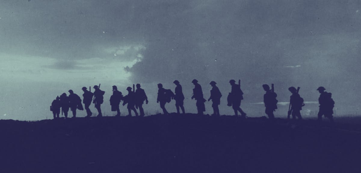 Soldiers walking together in the darkness