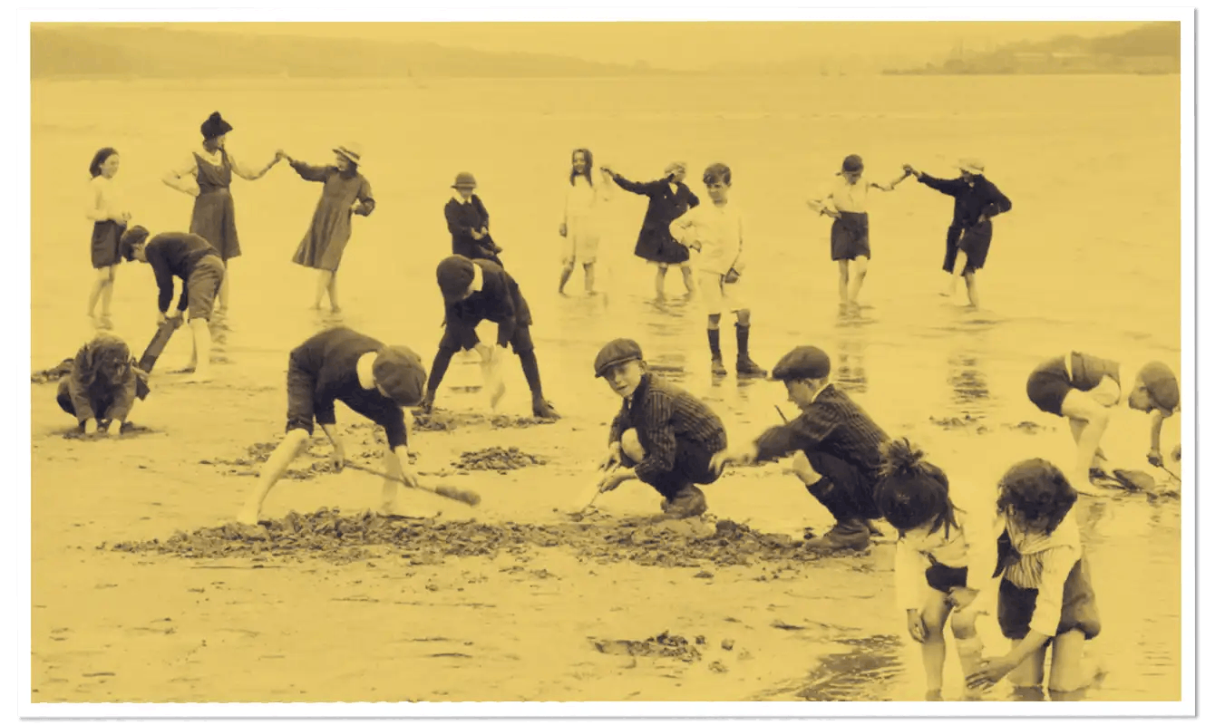 Lots of children from the 1940s playing on the beach