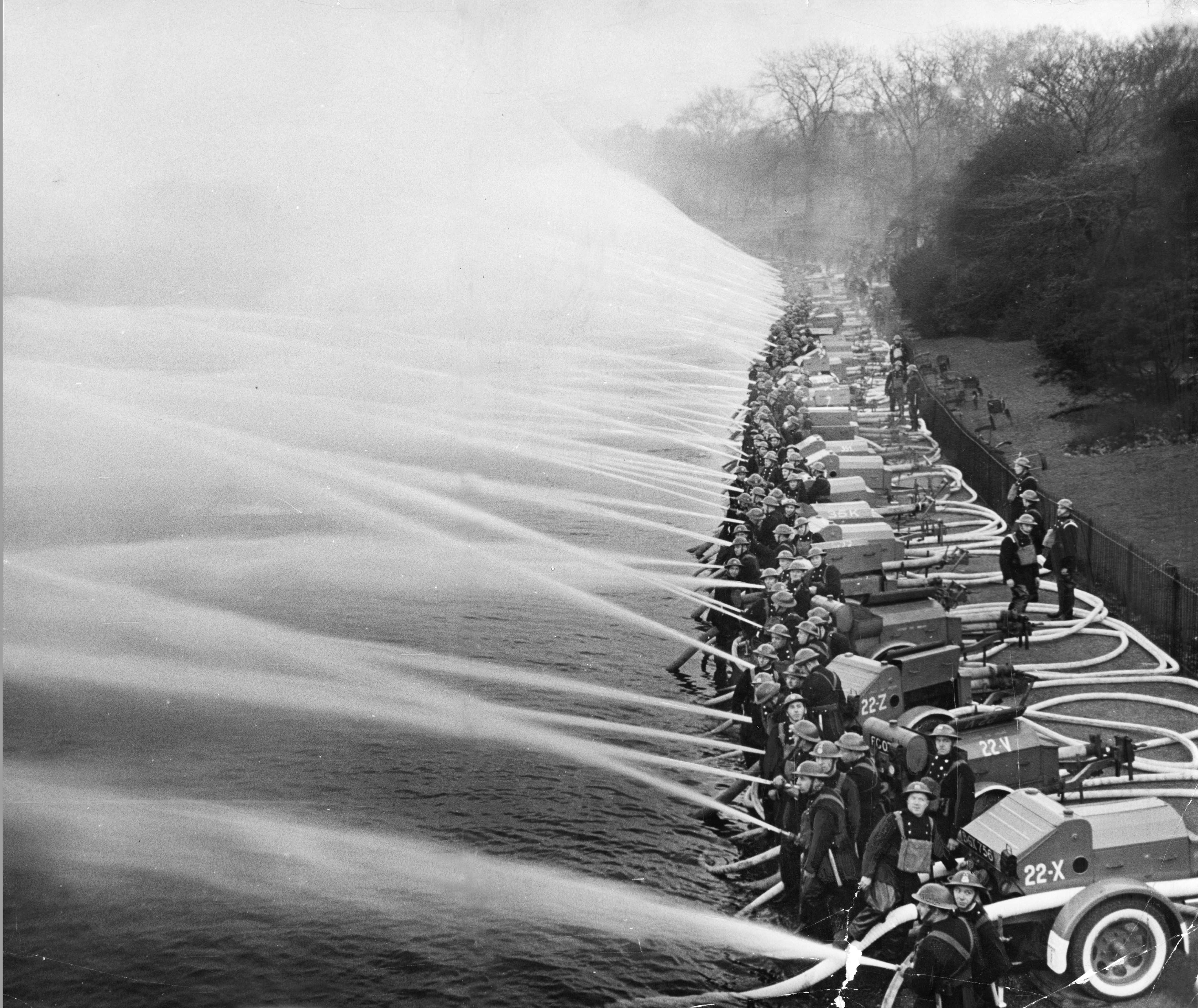 Firefighters training on the River Thames, 1940. 