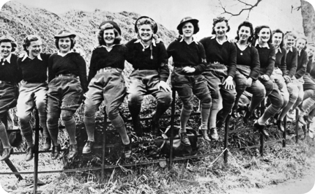 A group of Women's Land Army land girls posing for a photograph