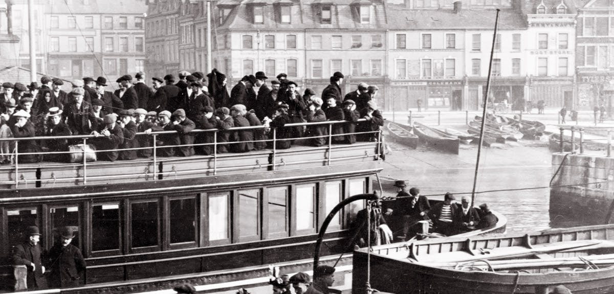 Old photo of a ship with immigrants