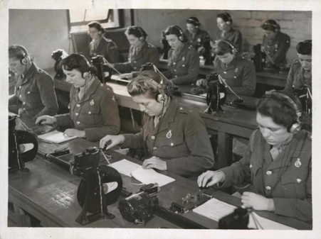 Women of the ATS being trained as wireless operators and learning Morse code at a special training battalion.