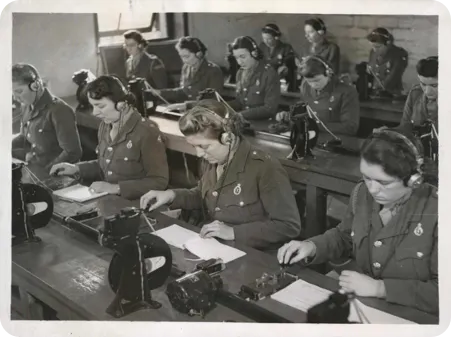 Women of the ATS being trained as wireless operators and learning Morse code at a special training battalion.