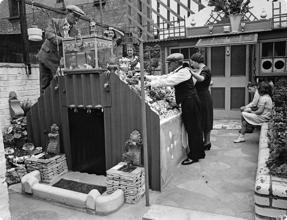 An Anderson Shelter being decorated by a family during the Second World War