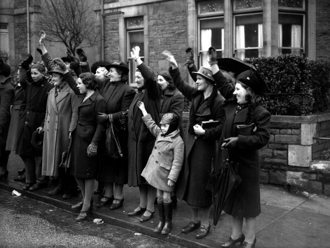 Bristol parents waving children goodbye. 