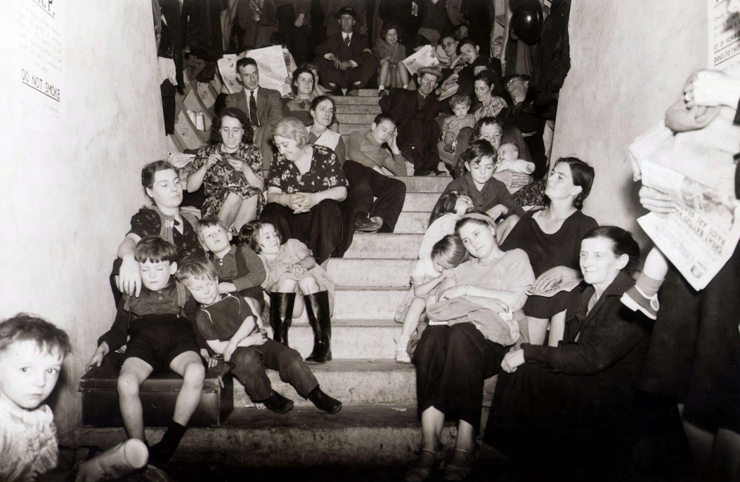 Families shelter in a disused London Underground tunnel, September 1940. 