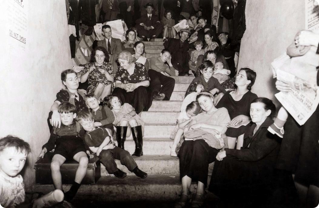 Families shelter in a disused London Underground tunnel, September 1940.