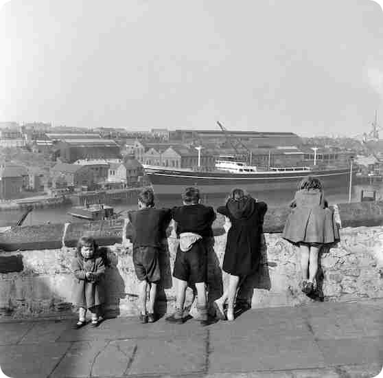 Children looking over the River Wear in Durham, 1954.