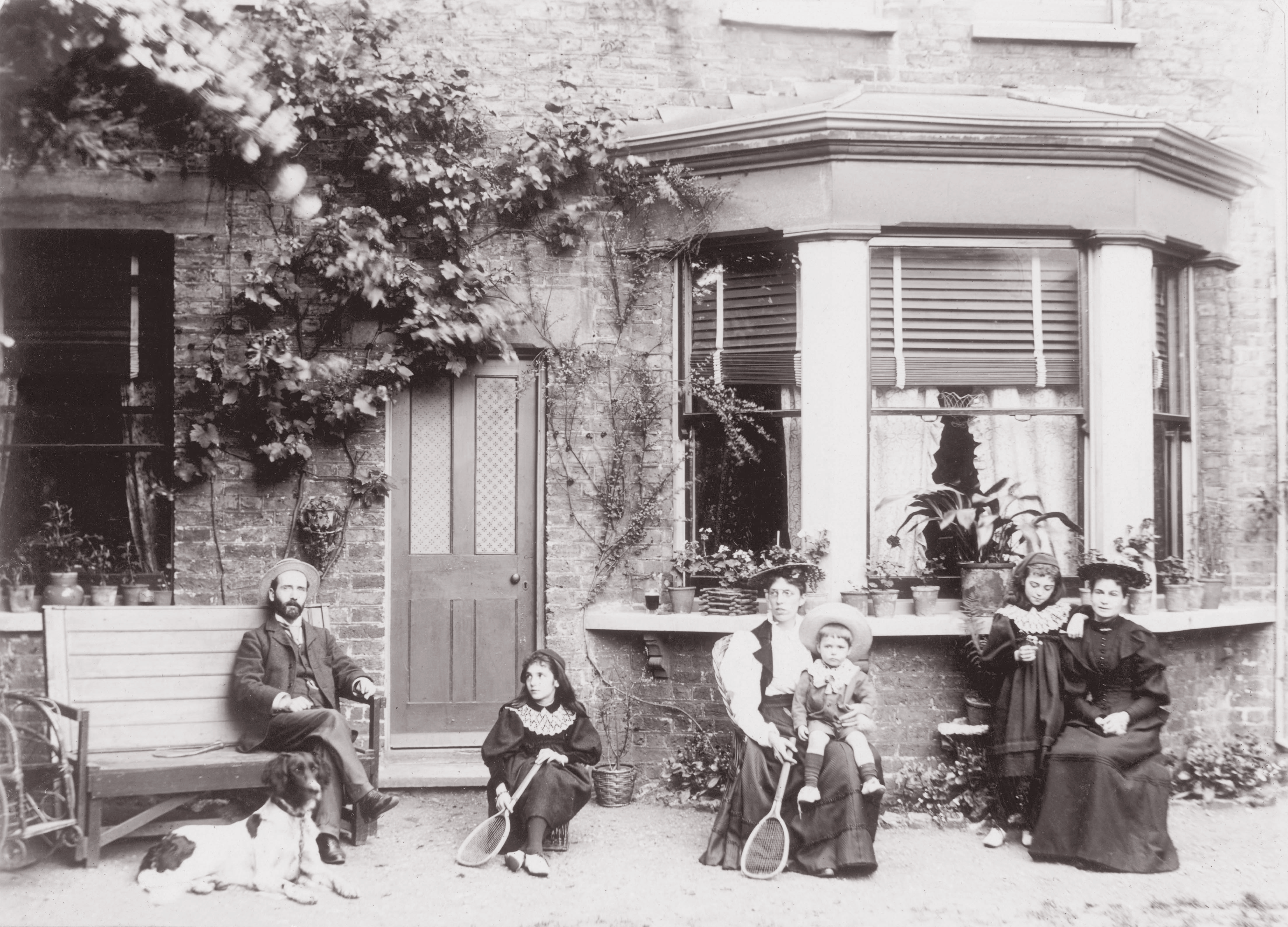 Family in Sussex garden with dog