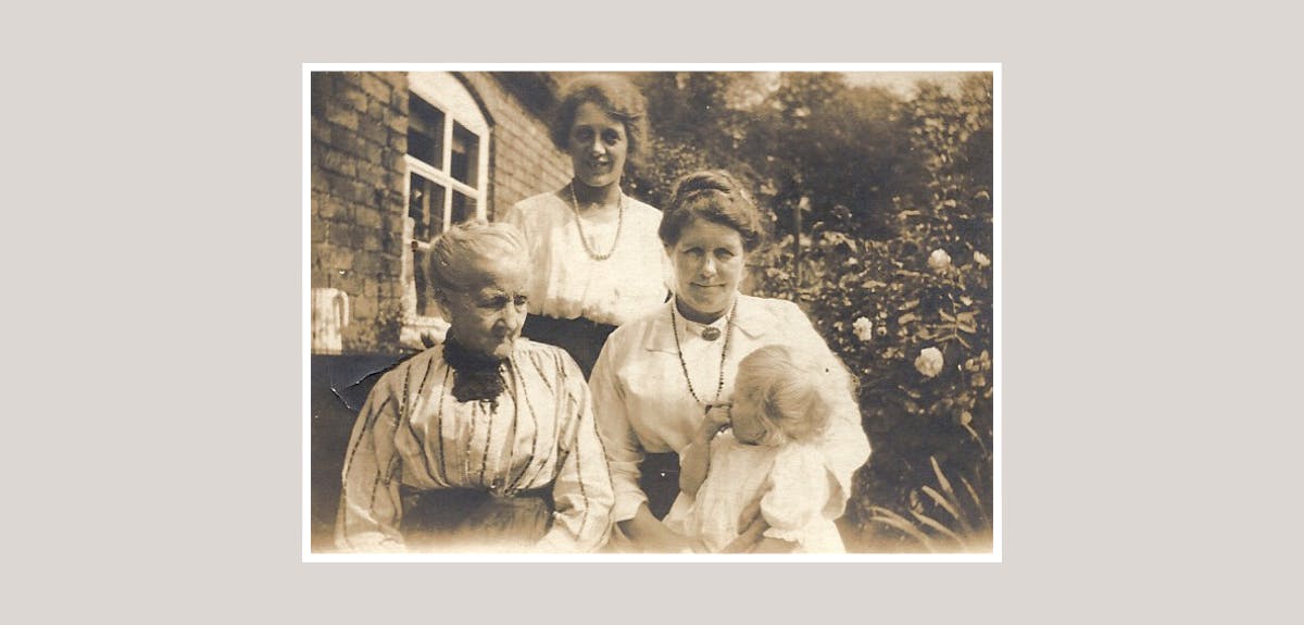 Historical photo of three women and a baby