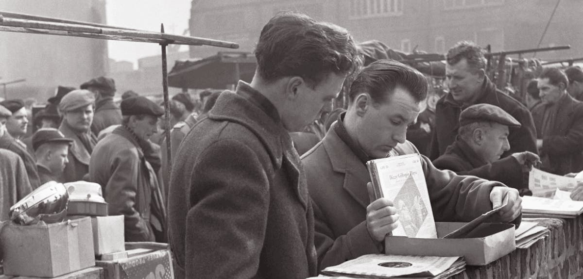 Men browsing records at a stall in the 1950s