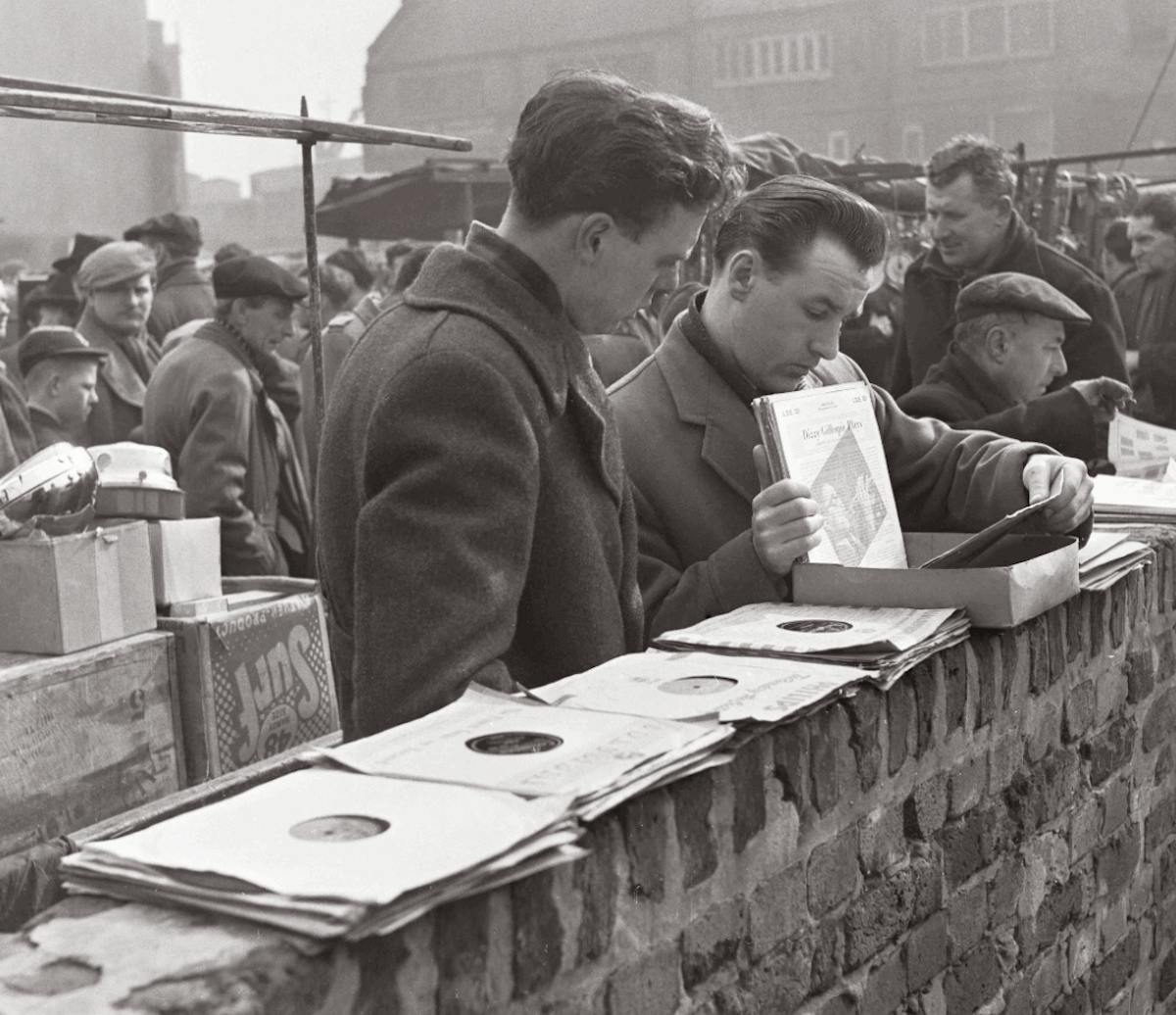 Men browsing records at a stall in the 1950s