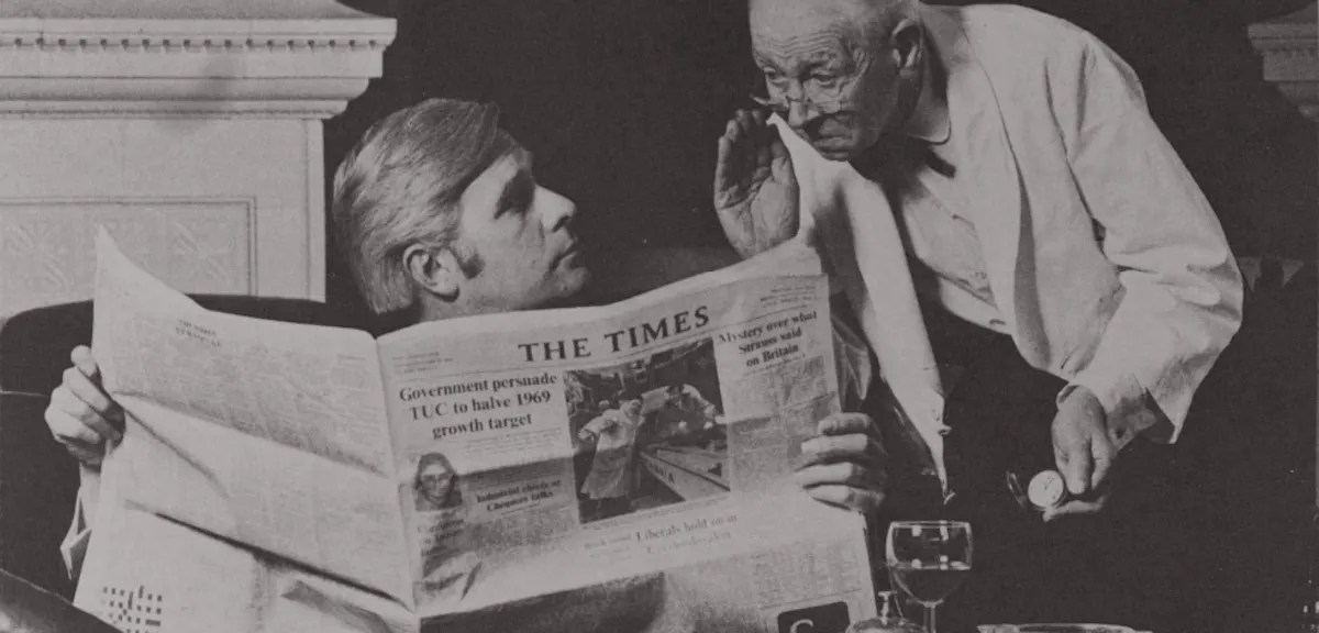 Two men and a newspaper