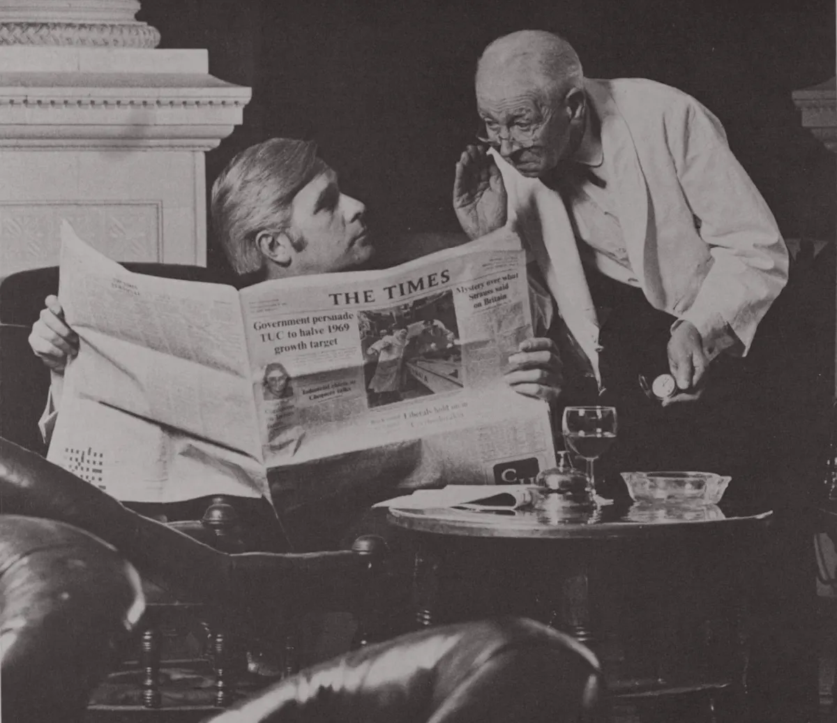 Two men and a newspaper