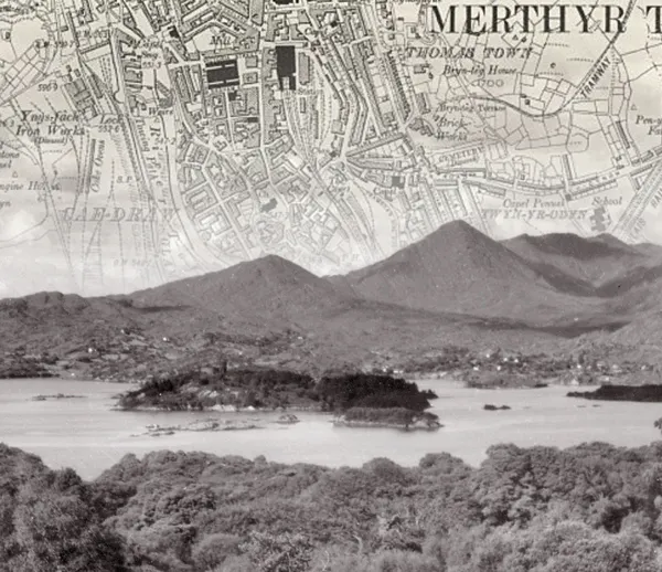 Black and white photo of a lake, with an old map of Merthyr Tyfil fading into the sky