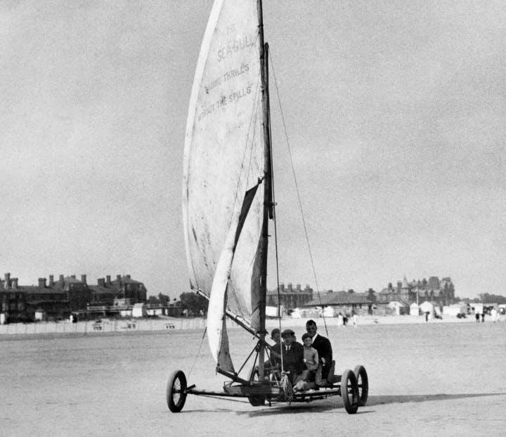 A family enjoying land-yachting on a beach in Skegness, 1925