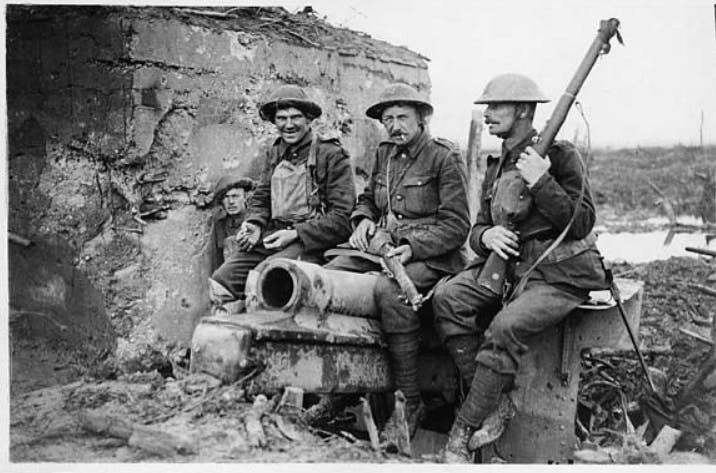 Members of the Coldstream Guard, sat on top of a newly-captured German gun during World War 1.