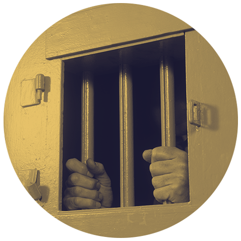 Prisoner's hands gripping prison cell bars