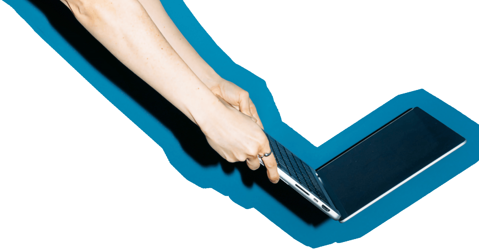 A laptop being held at arms length at a jaunty angle.