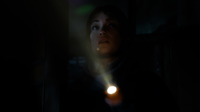 Torchlit character still from Until Dawn 2 
