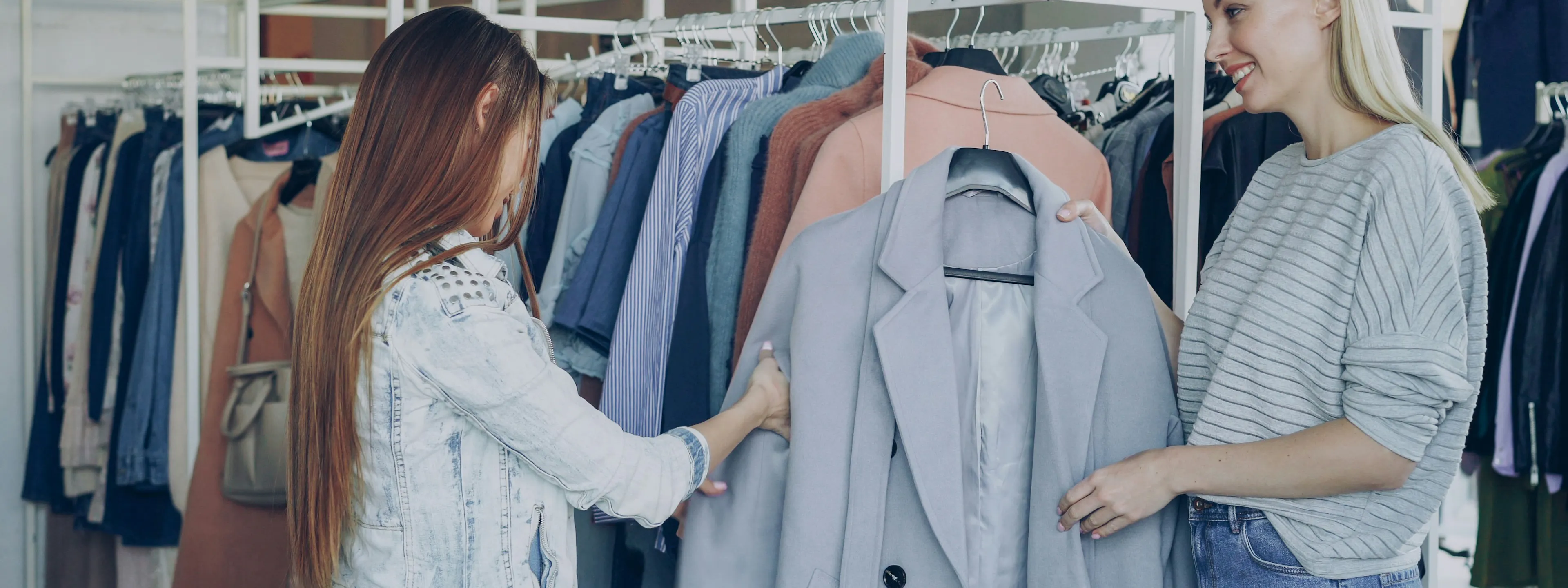 woman shopping in store with help from saleswoman