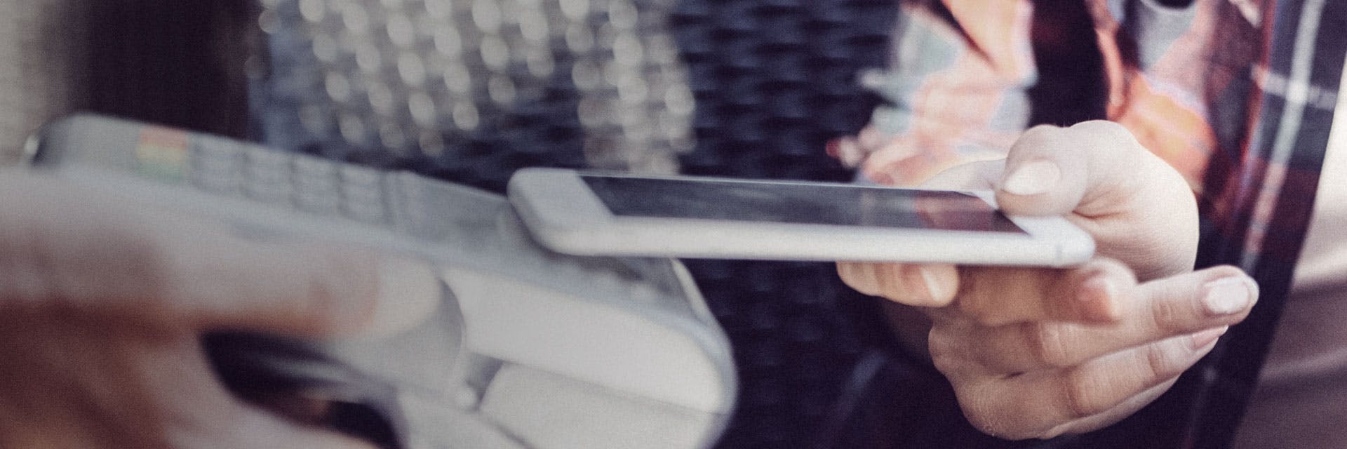 A person paying with a smartphone.