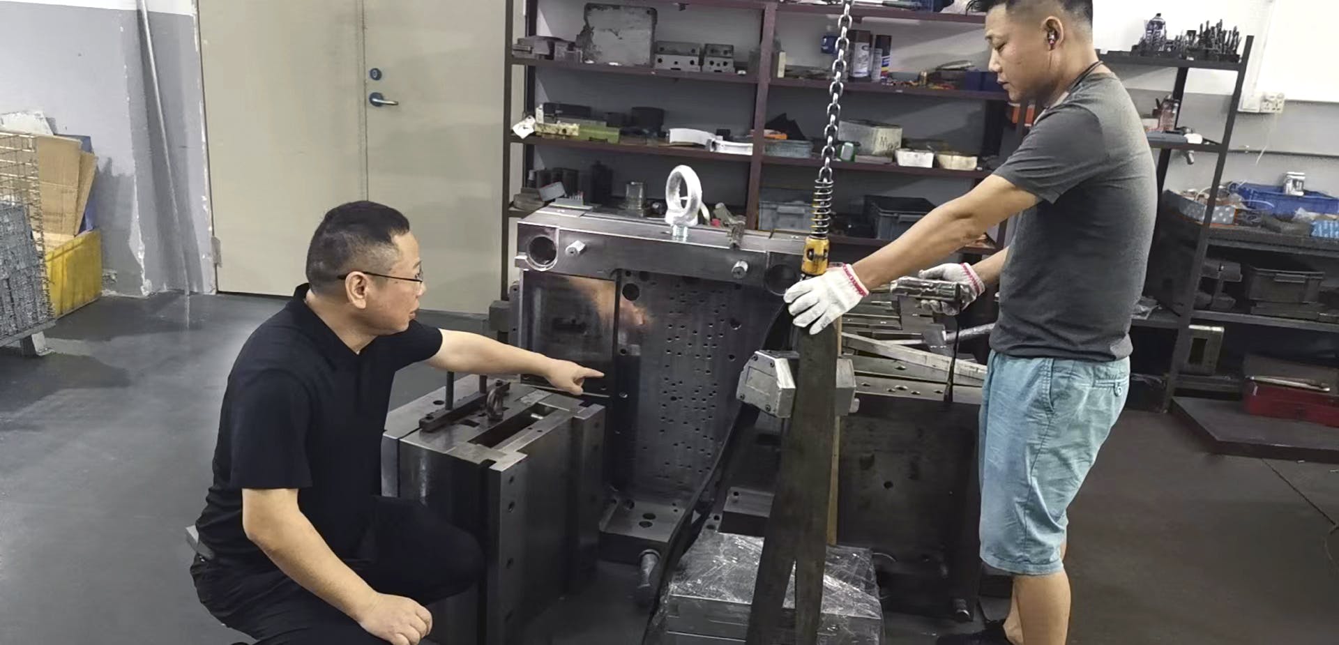 Chinese factory boss leading worker