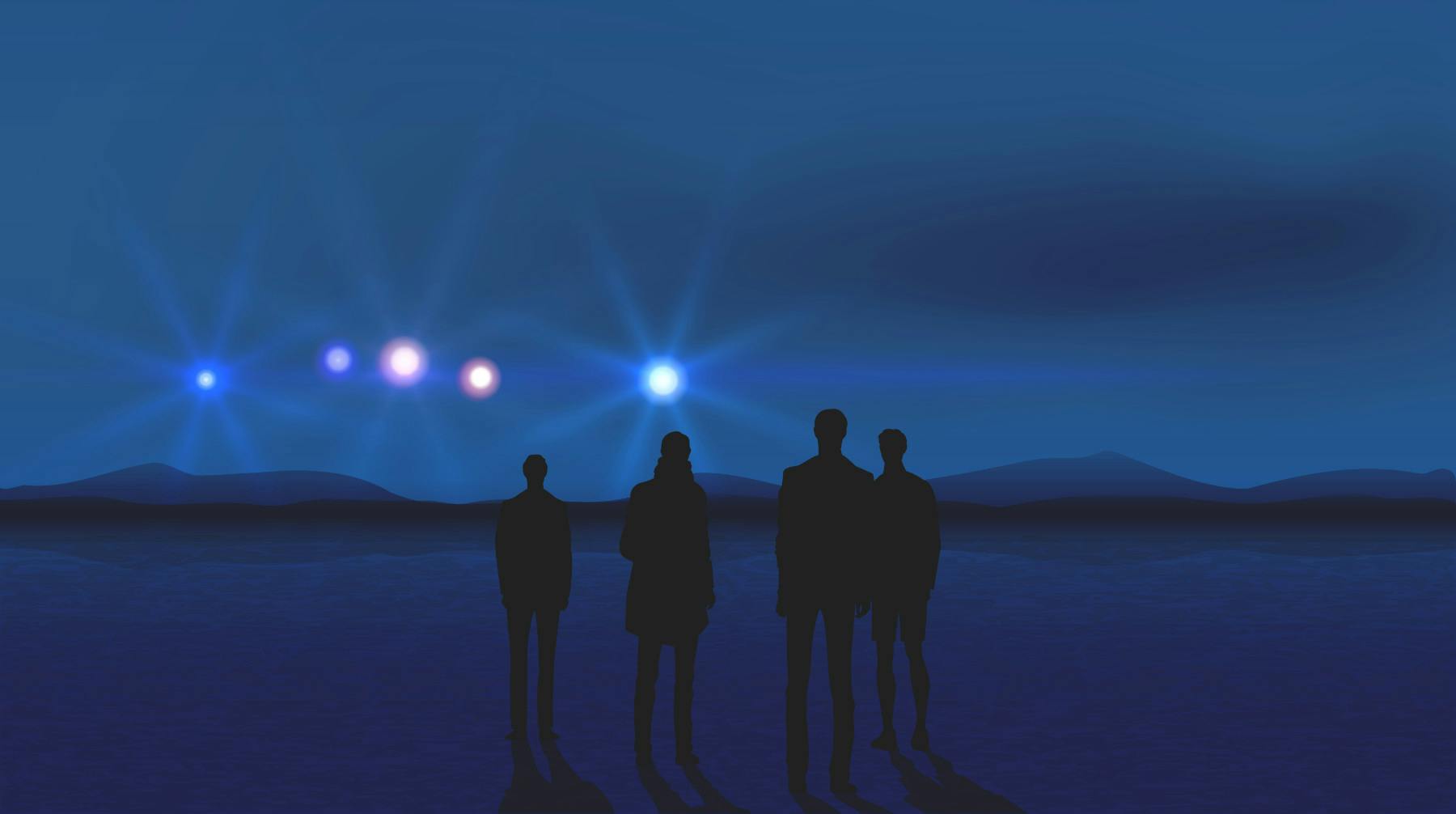 people looking at lights in the sky