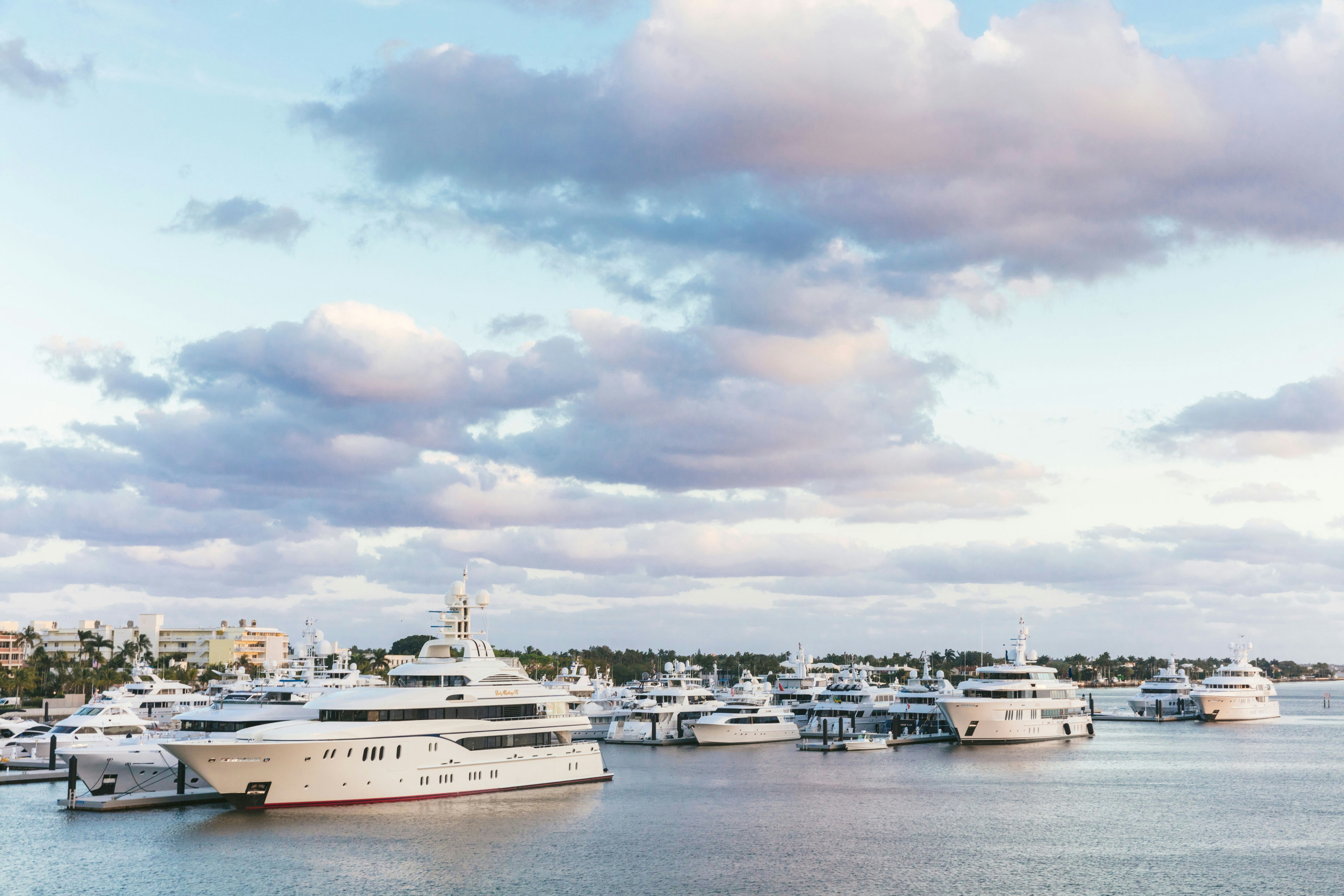 Marina filled with yachts on a cloudy day.