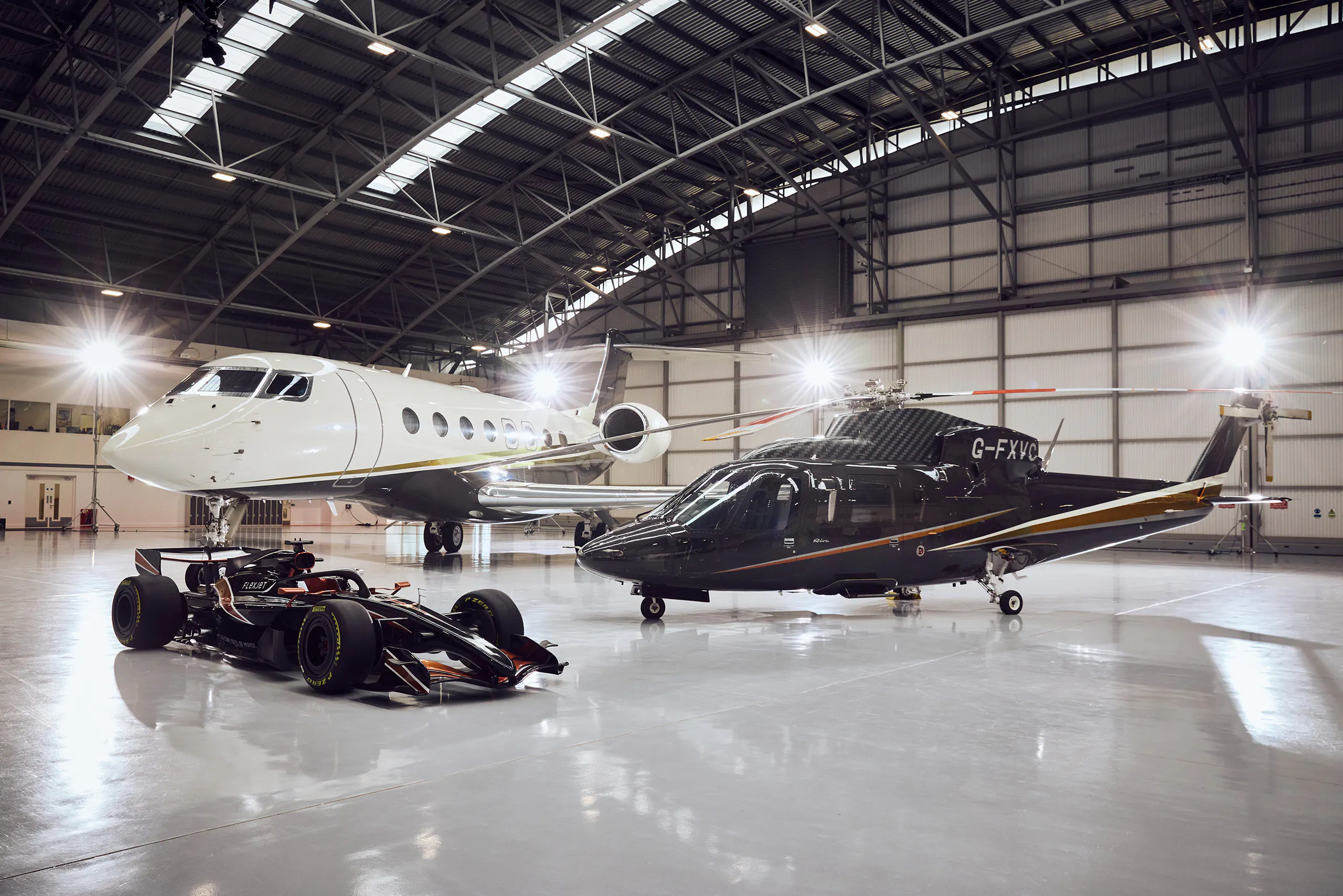 F1® car with a private jet and helicopter