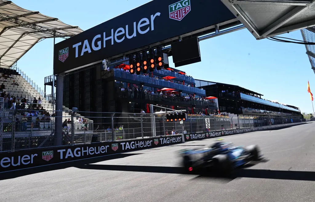 Action shot of an F1 car blurring through the finish line