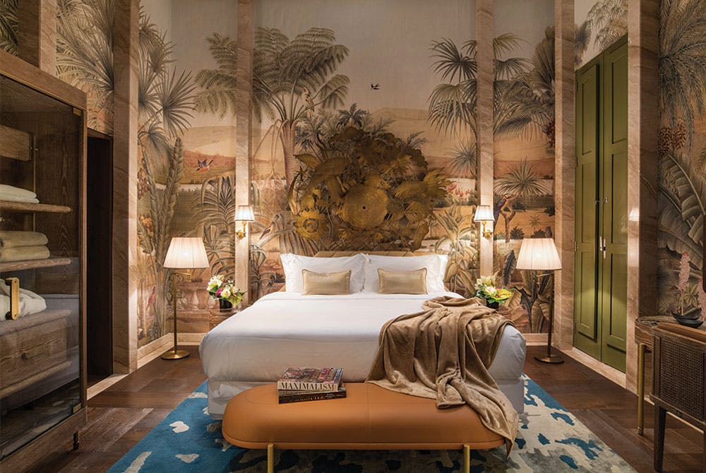 Bedroom with browns and greens and tans giving a woodsy but clean feel