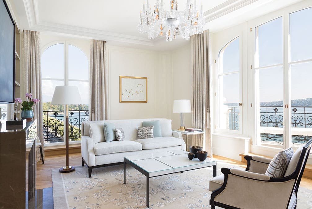 Clean and modern room with windows that show the waters outside