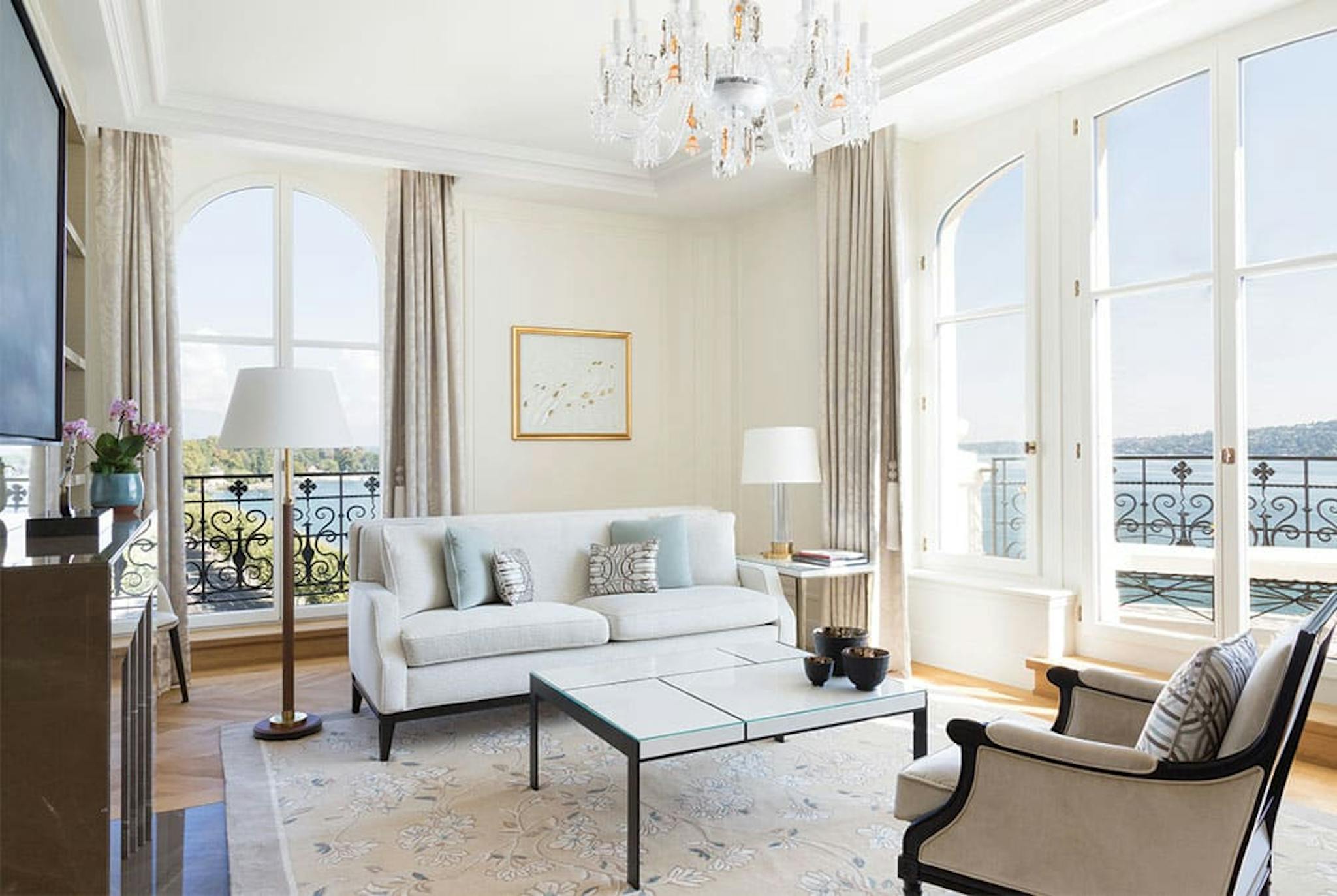 Clean and modern room with windows that show the waters outside