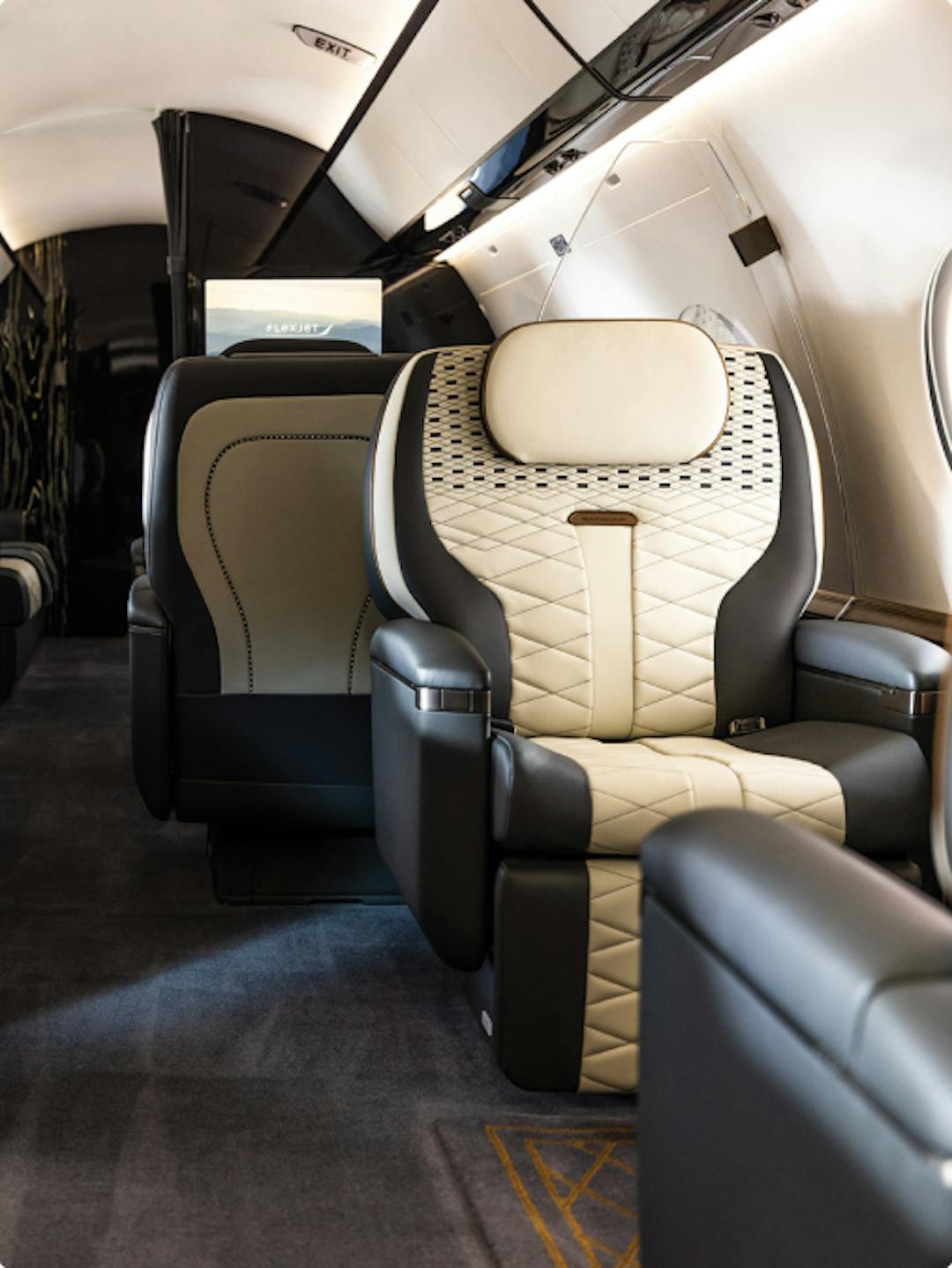 Custom interior, focused on the black and light tan seating