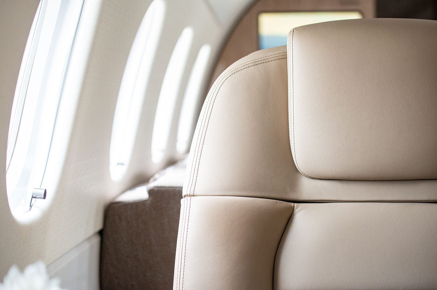 Close up of the seat near illuminated window ovals