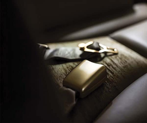 close up of seatbelt components laying on the seat