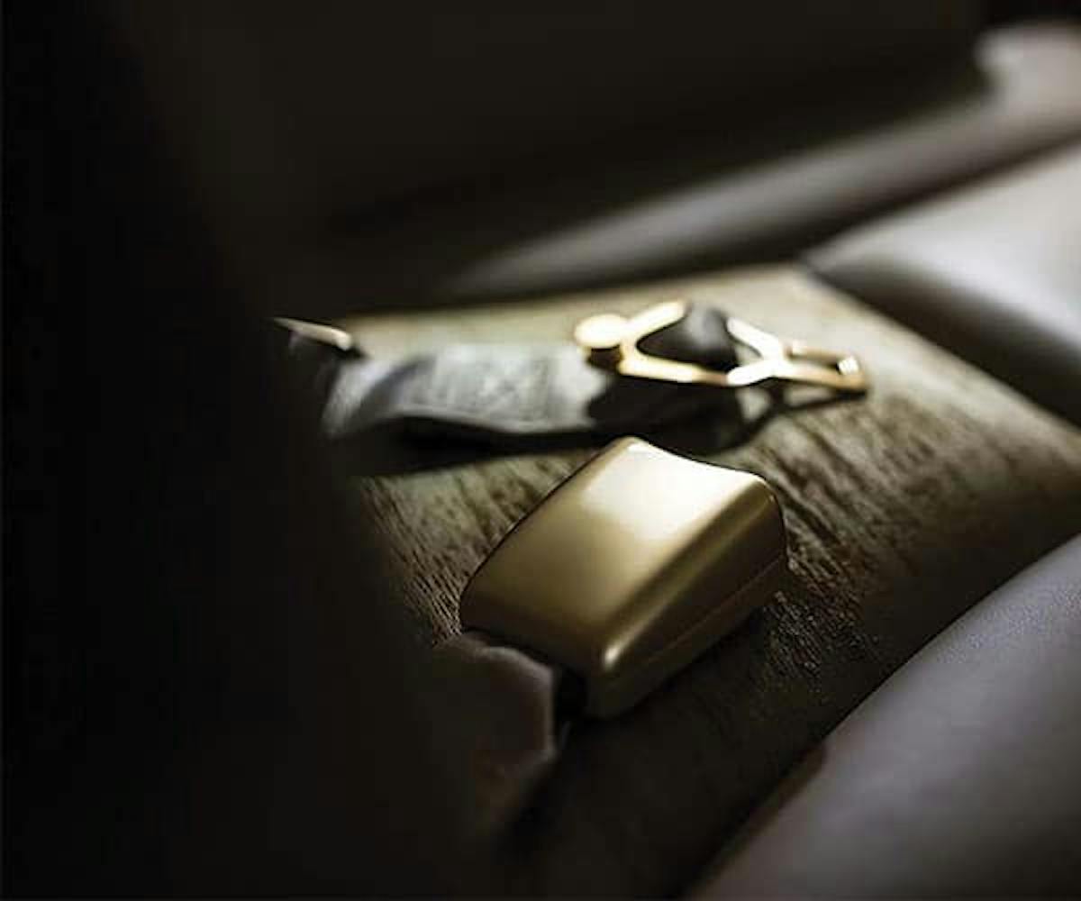 close up of seatbelt components laying on the seat