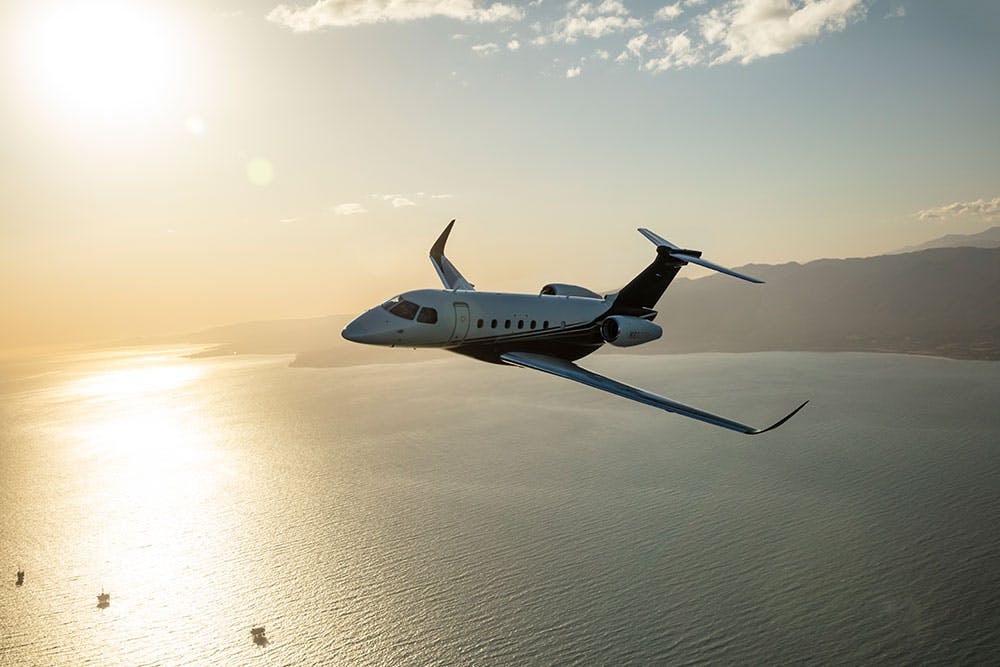 praetor 600 flying over ocean