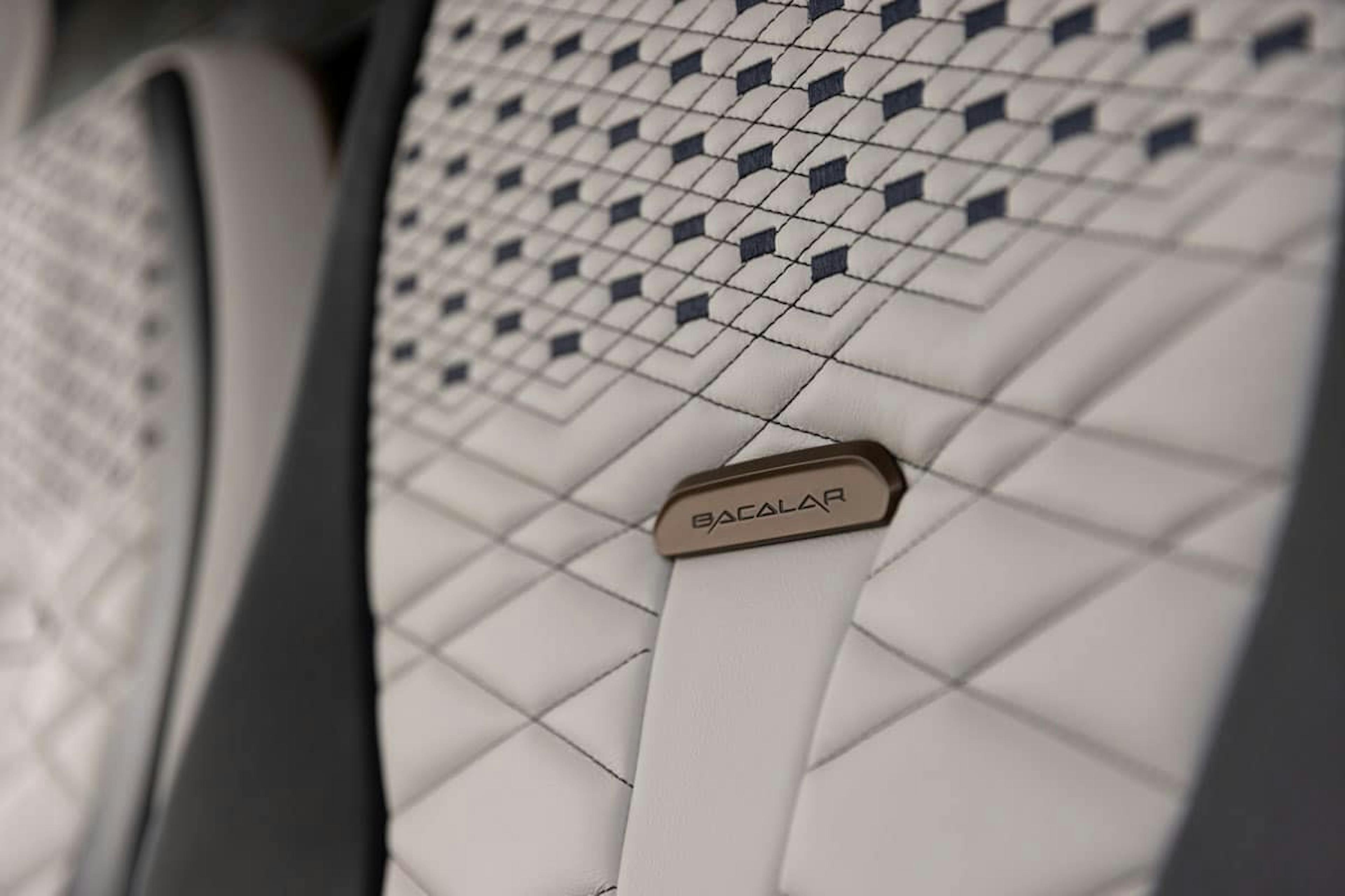 Inside the custom interior, the seatback upholstery in black and white pattern has a Bacalar tag