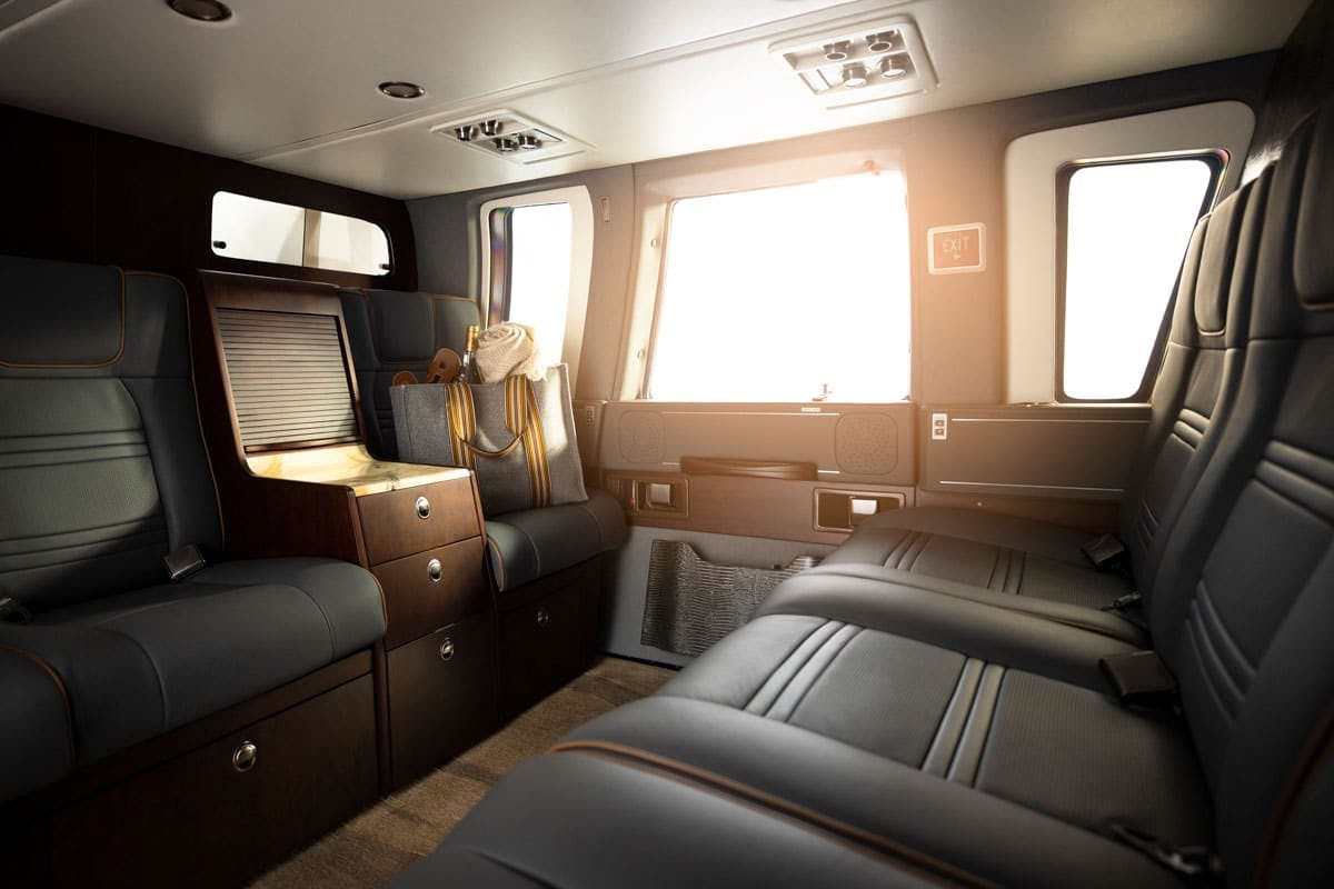 Dark themed interior of the Phantom cabin on the Sikorsky S 76