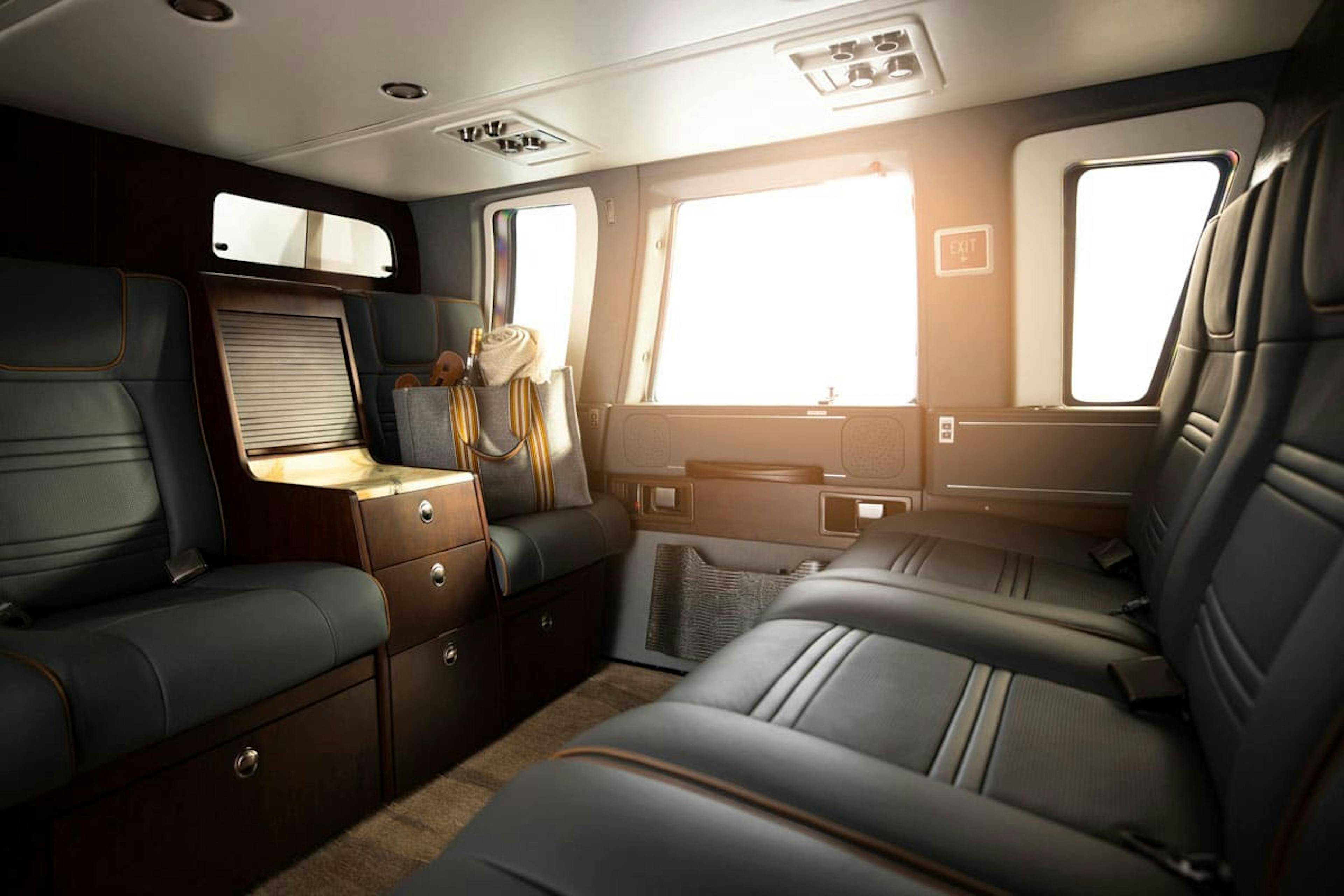 Dark themed interior of the Phantom cabin on the Sikorsky S 76 