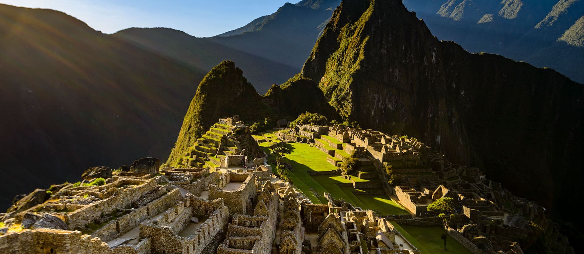 the ruins of ancient machu pichu on the side of the mountain with views of other ridges