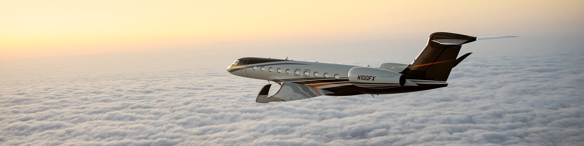 A G700 flies above the clouds