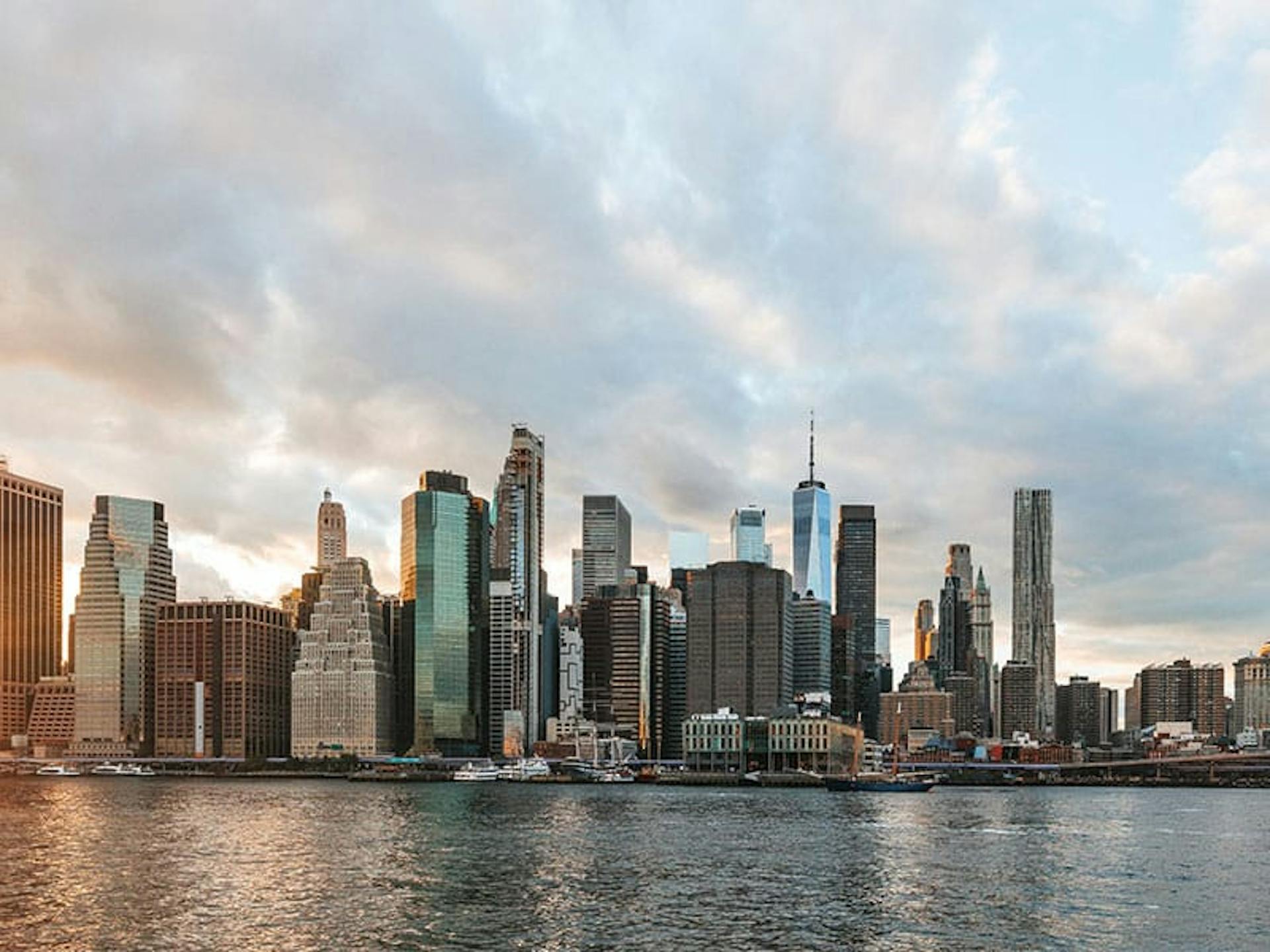 the view of a city skyline from a body of water