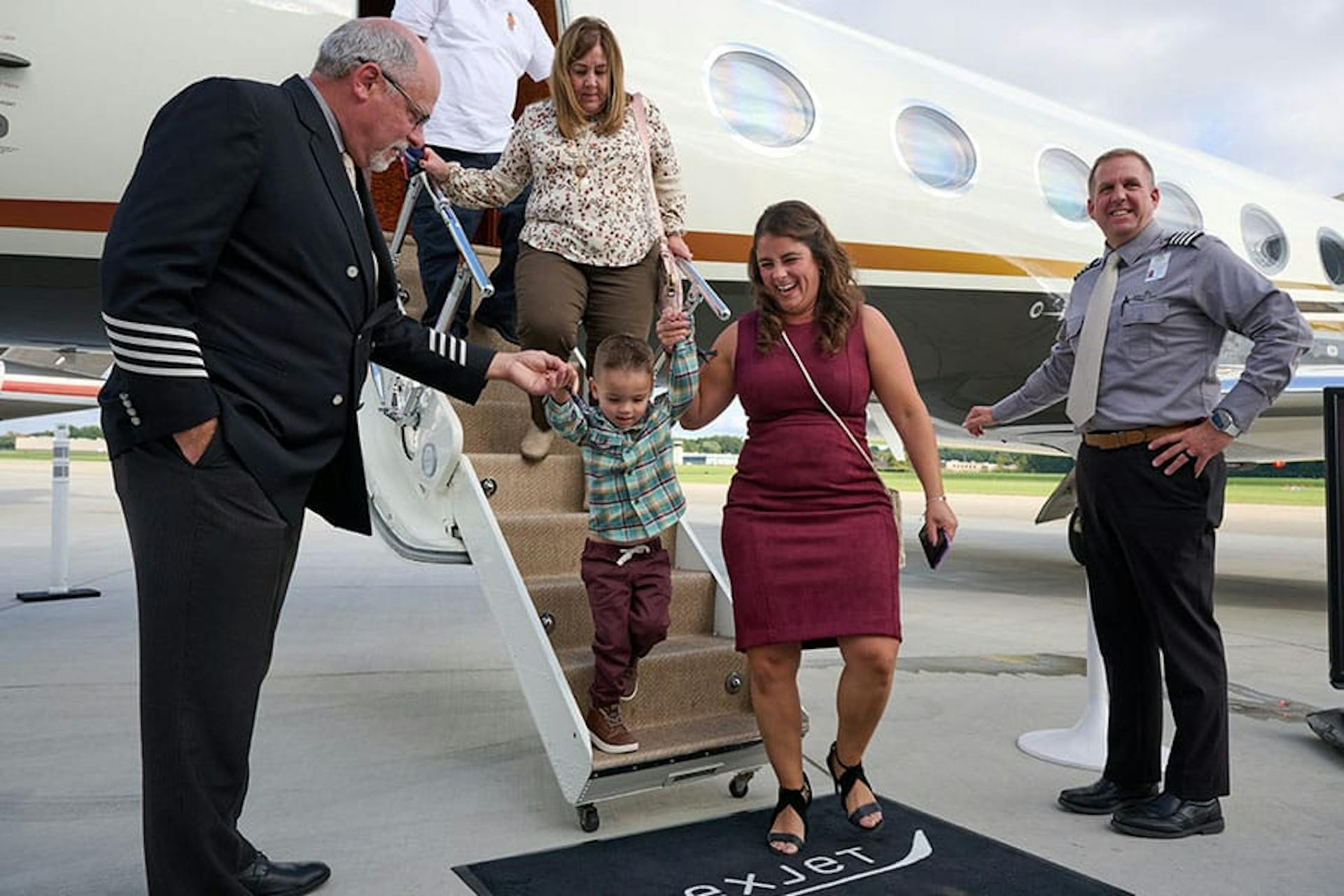 family stepping down from the aircraft
