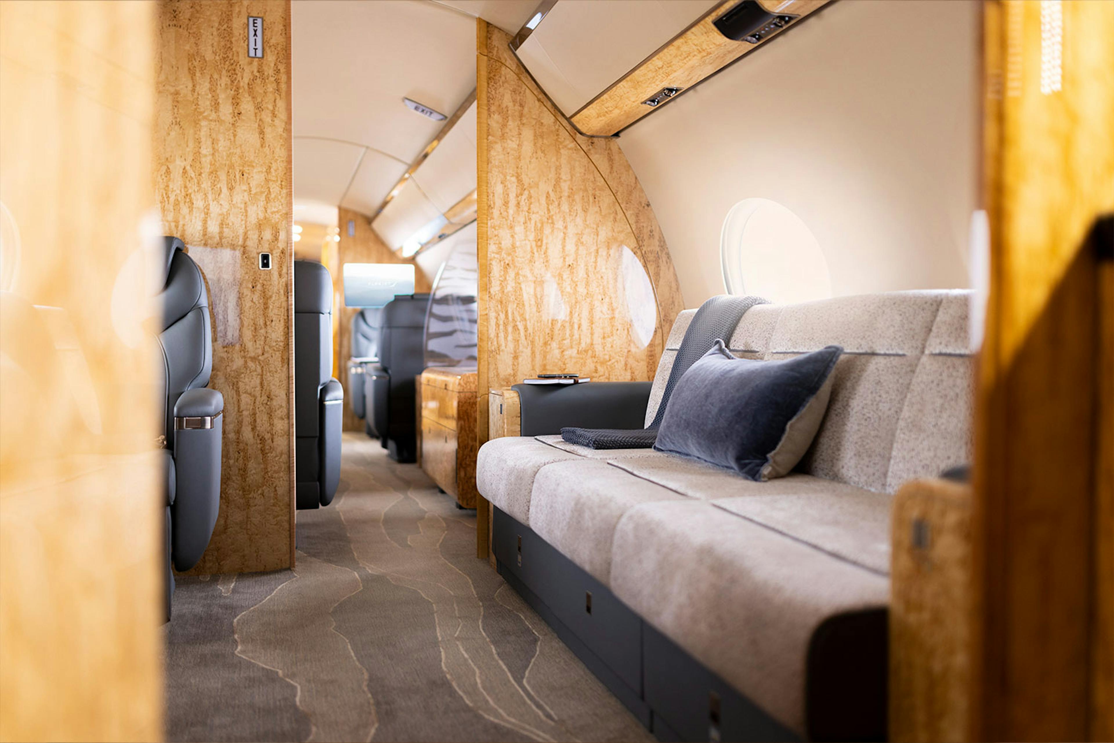 Luxury interior Capri inside a private jet focused on the sofa and its dedicated area