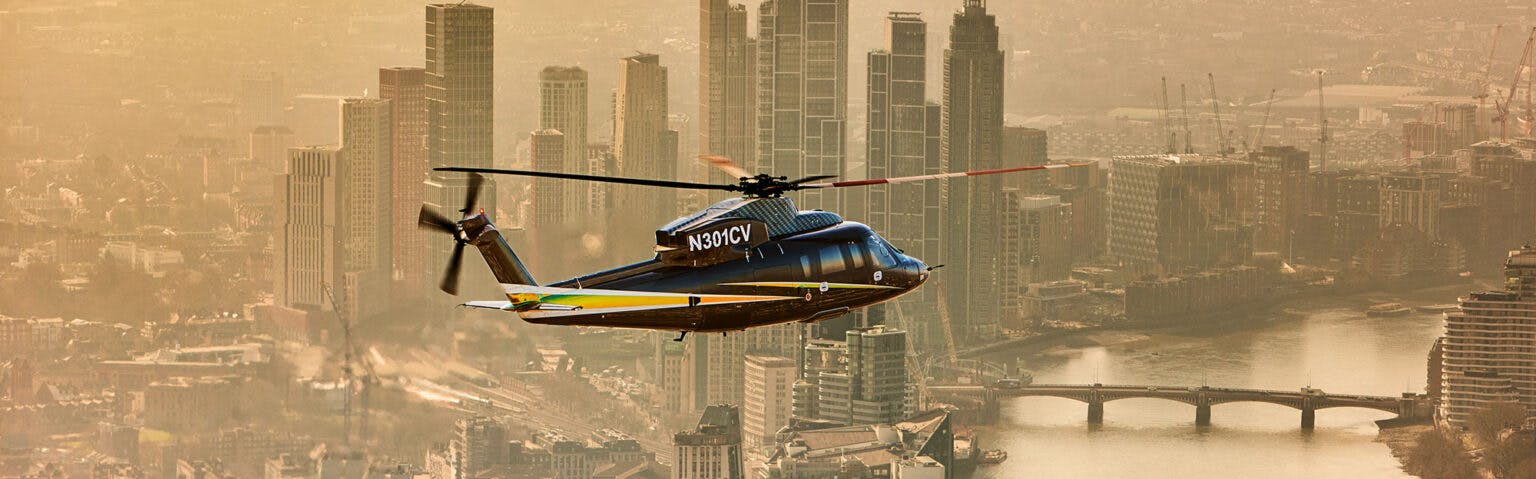 EU version of the S76 image break which is a helicopter flying over a populated city