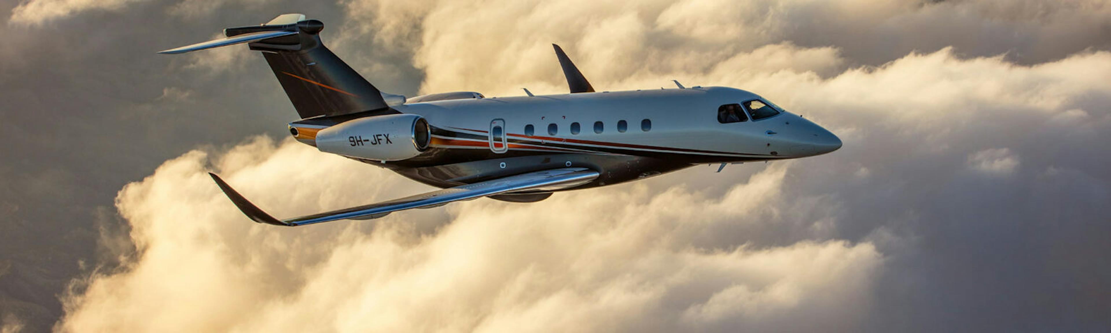 Jet card image spacer feature a flexjet aircraft flying above the clouds