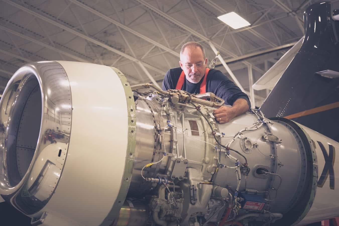 mechanic working on aircraft engine